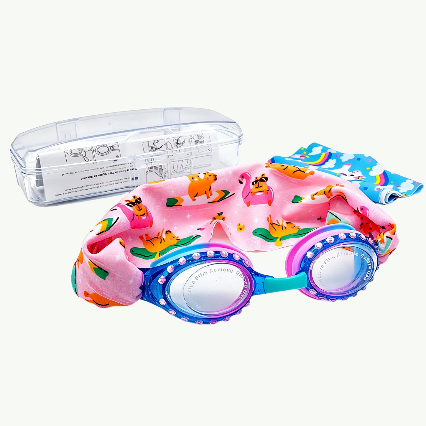 EasyStrap kids swim goggles in blue pink with flamingo fun fabric strap, bonus unicorn sky strap, hard case, and user manual included