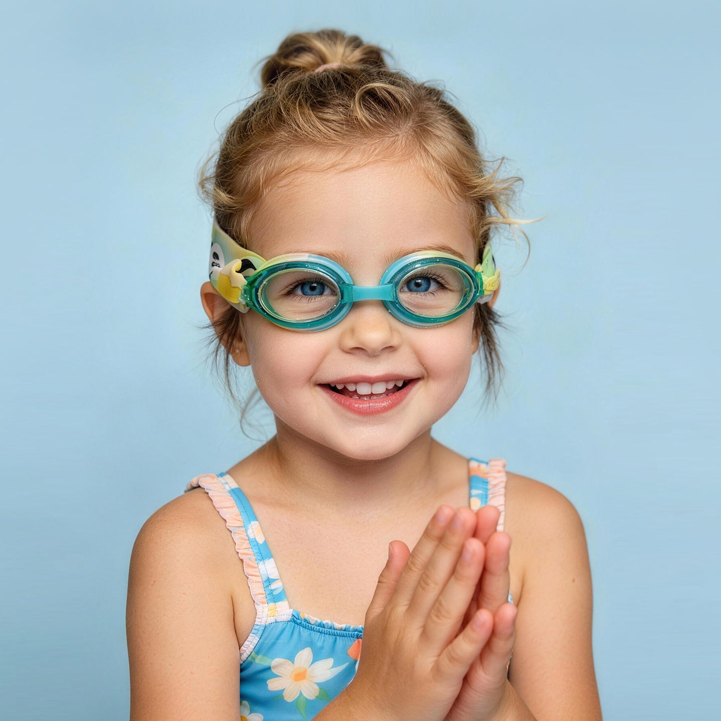 Happy child wearing kids swim goggles, smiling and ready to swim