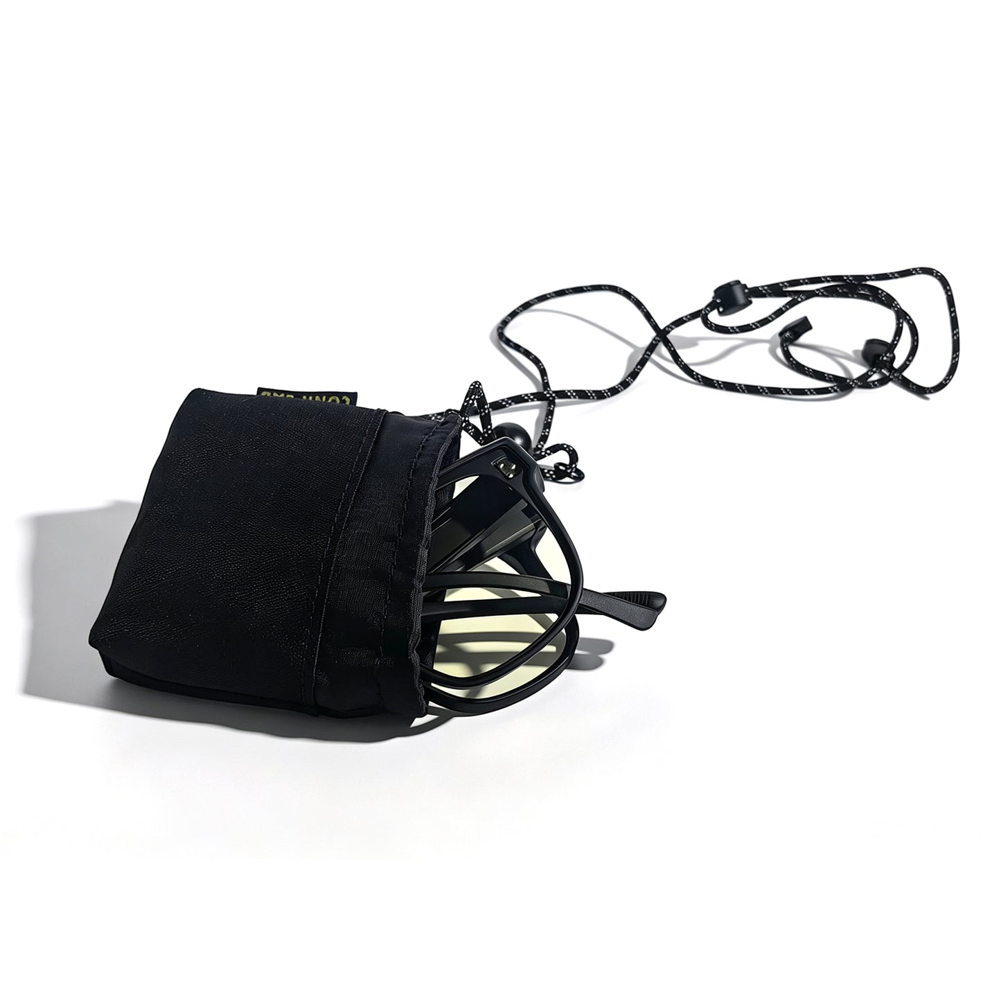 Black storage pouch holding yellow-lens fit-over night driving glasses with an adjustable neck strap.