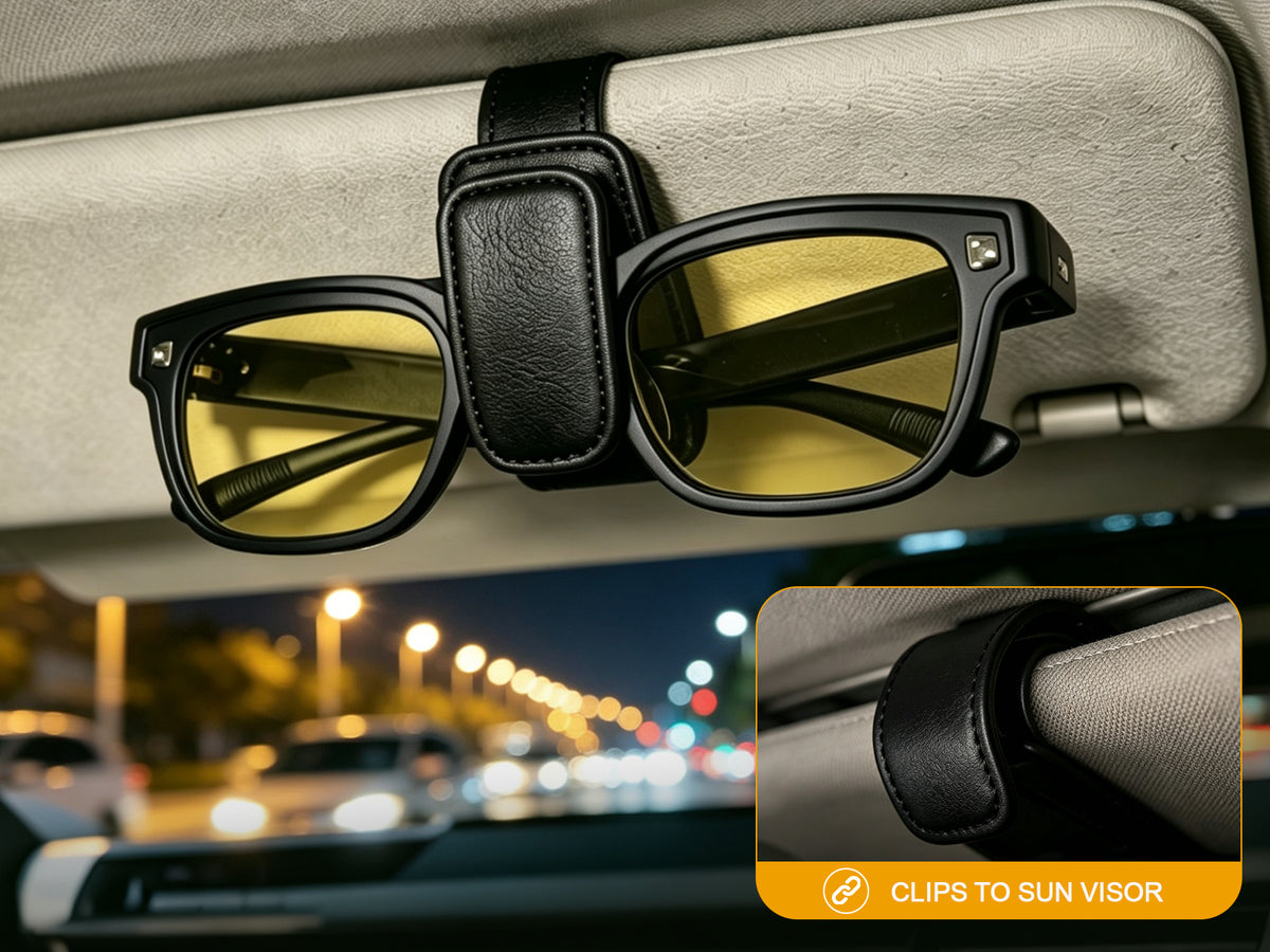 Fit-over night driving glasses secured to a car sun visor with the included visor clip