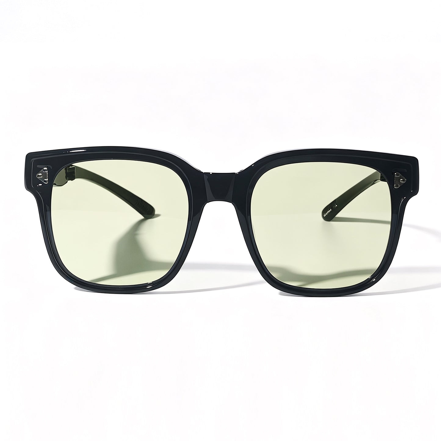 Glossy black fit-over night driving glasses with yellow-tinted lenses, shown from the front