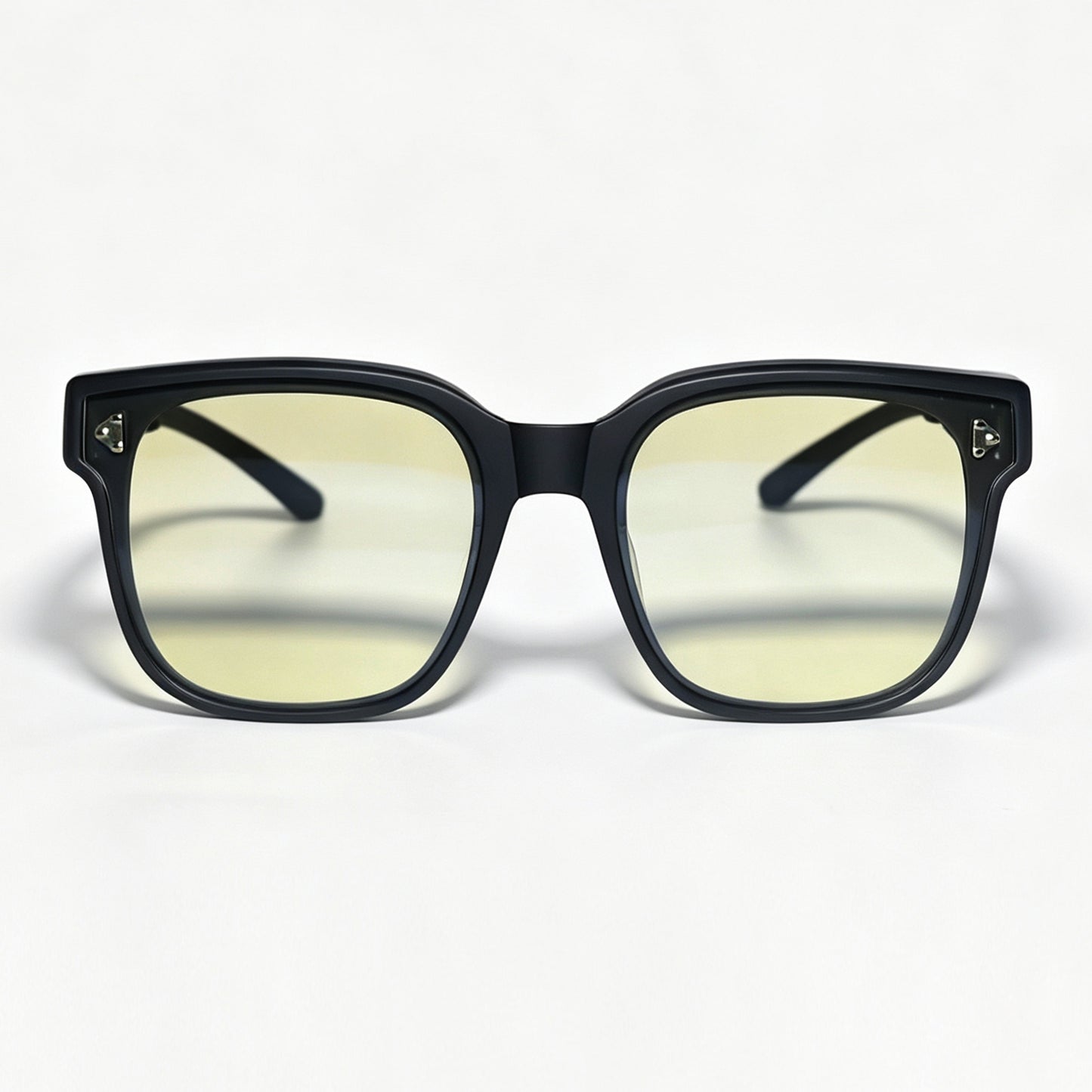 Front view of matte black fit-over night driving glasses with light yellow lenses