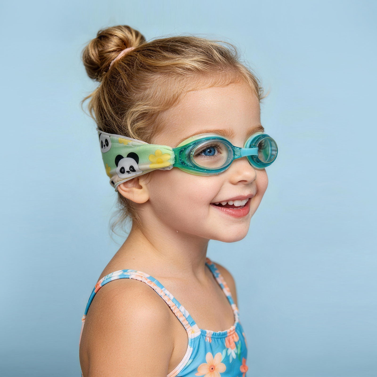 Side view of kids swim goggles with soft fabric strap that prevents hair pulling