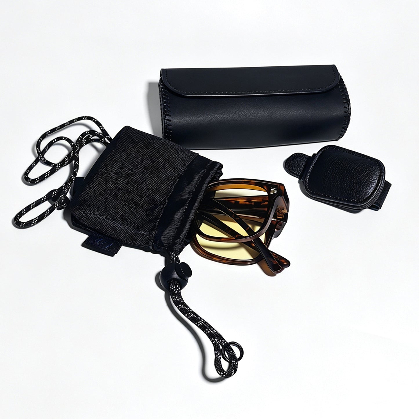 Folded tortoiseshell fit-over night driving glasses with visor clip, protective storage box and microfiber pouch