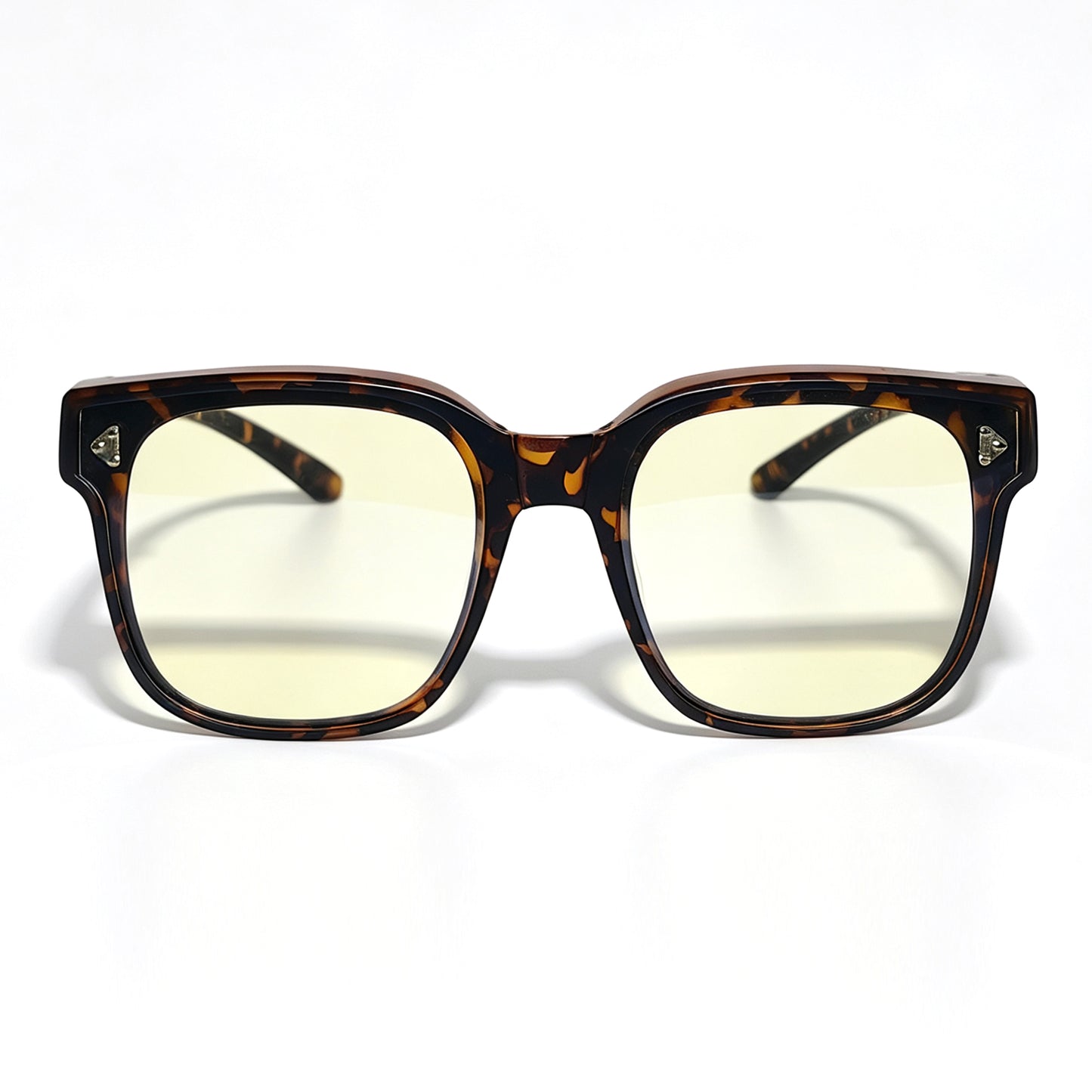Tortoiseshell fit-over night driving glasses with yellow-tinted lenses, shown from the front.
