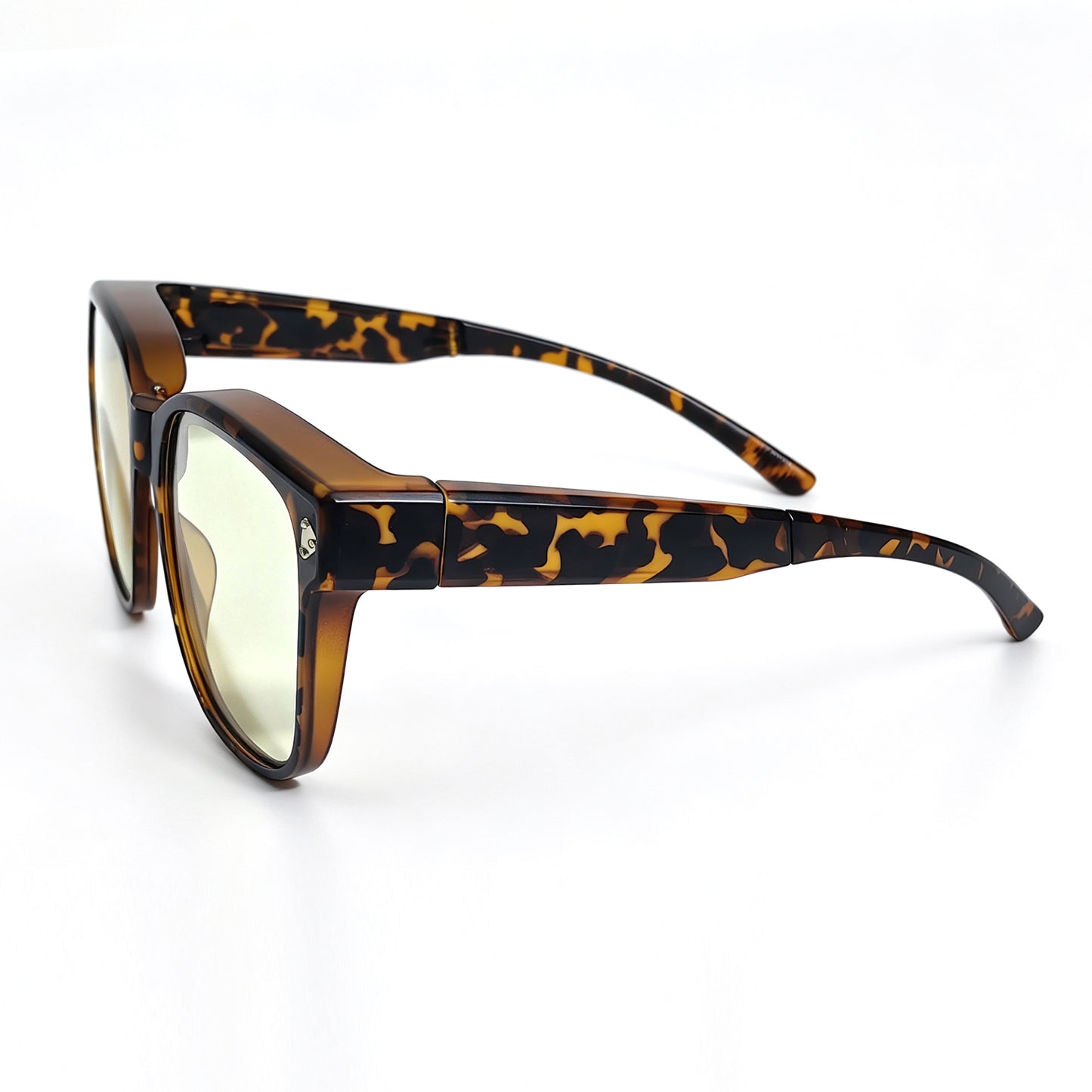 Tortoiseshell fit-over night driving glasses with yellow-tinted lenses, shown from a side angle with the temples fully extended.